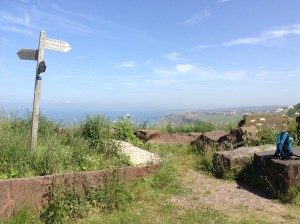 Signpost after the quarry and a steep climb along cliffs. 