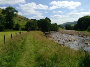 Walking by river through farmlands.