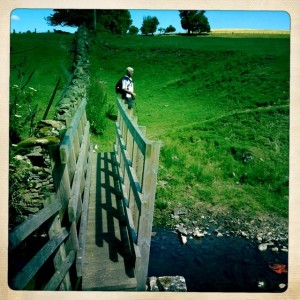 Crossing narrow footbridge