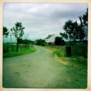 Tony walking on driveway looking for a place to stop and eat our meager lunch.