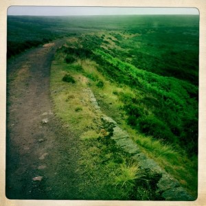 Sides drop away but valley in mist.